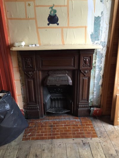 Spare room fireplace after.jpg