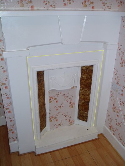 dining room fireplace - cast iron inside yellow lines.jpg